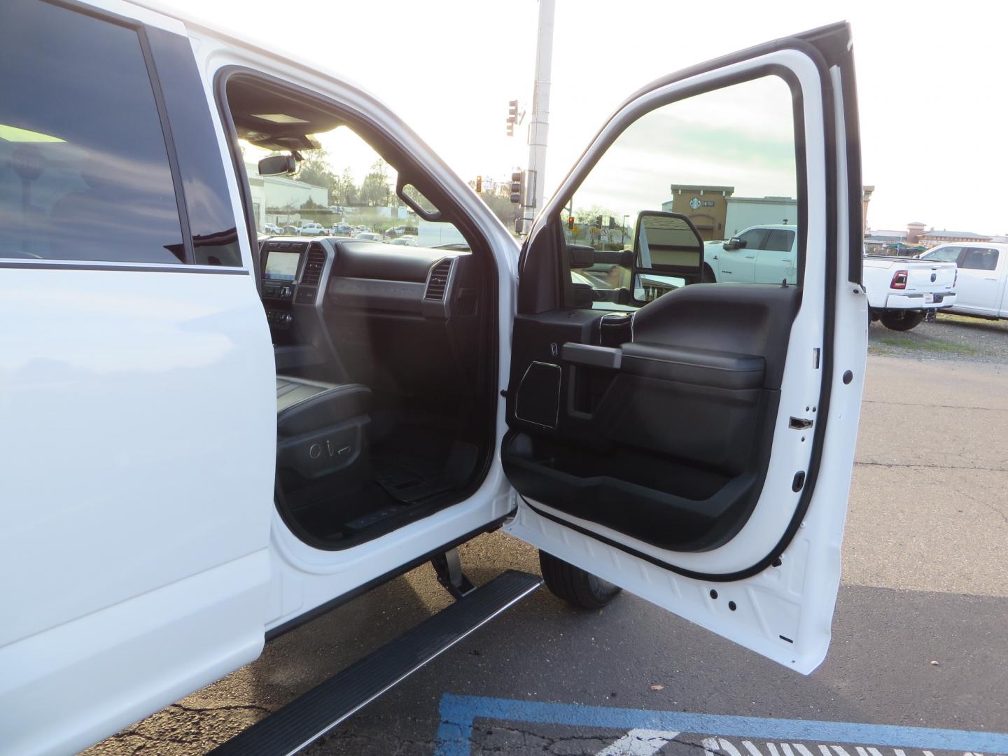 2020 White /BLACK Ford F-450 SD PlatinumCrew Cab DRW 4WD (1FT8W4DT4LE) with an 6.7L V8 OHV 16V DIESEL engine, 6A transmission, located at 2630 Grass Valley Highway, Auburn, CA, 95603, (530) 508-5100, 38.937893, -121.095482 - Must see F450 with a tool box refueling station, window tint, and a center console vault. - Photo#46